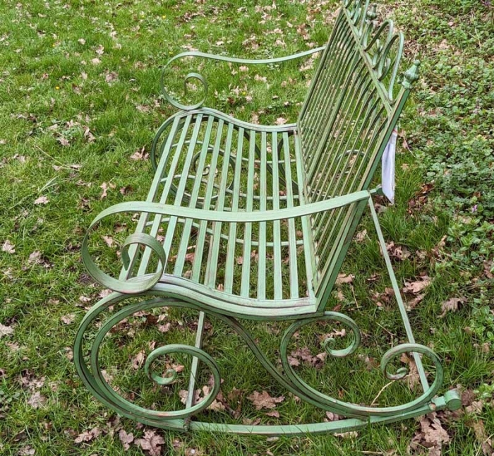 Green metal garden bench rocker