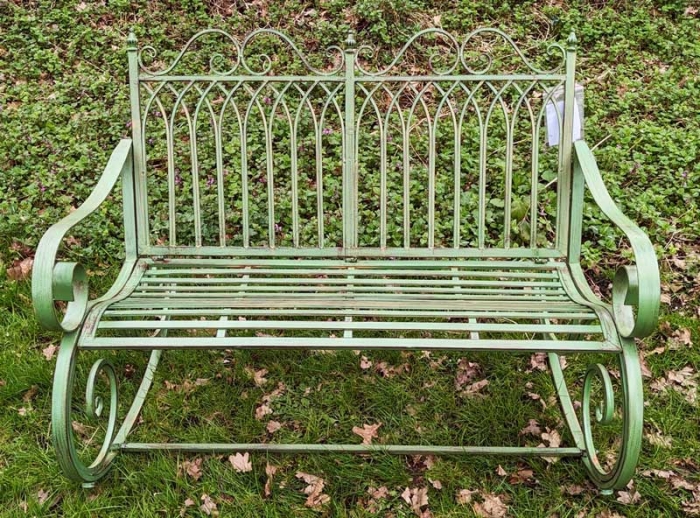 Green metal garden bench rocker