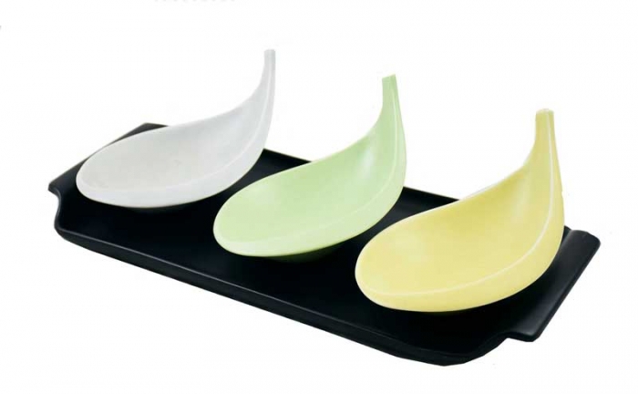 Vintage pastel colored serving dishes on black tray