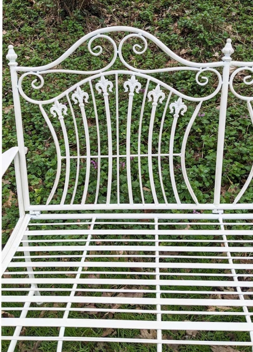Small white metal garden bench
