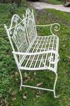 Small white metal garden bench