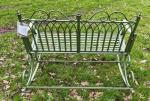 Green metal garden bench rocker